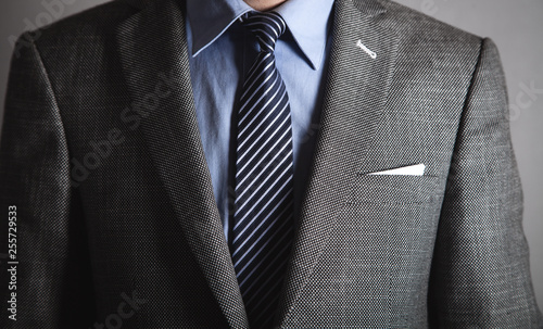 Stampa su Tela  Businessman in blue shirt and jacket.