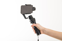 Woman Hand And Gimbal With Phone On White Background