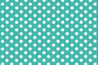 Turquoise background with symmetrical white polka dots