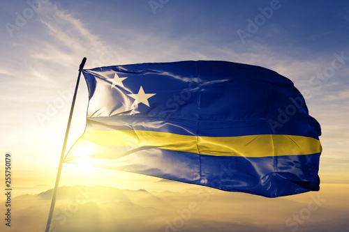 Curacao flag waving on the top sunrise mist fog Wallpaper Mural