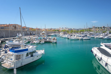 Wall Mural - View on Port Vauban in the French town of Antibes with Fort Carre in the background