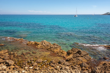 Wall Mural - View on the sea off the coast of Antibes, with the Cap d'Antibes peninsula in the background