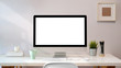 © bongkarn - Workplace with blank screen pc comfortable work table. Loft desk space