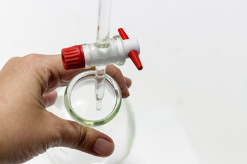 Wall Mural - chemical laboratory; scientist hand titration with burette and erlenmeyer flask, science laboratory 
