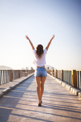 happy young woman enjoying freedom with open hands