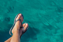 Relaxation Summer Vacation Concept Simple Wallpaper Pattern With Bare Female Feet In Flip Flops On Vivid Blue And Green Swimming Pool Water  Background With Empty Copy Space For Your Text