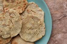 Handmade Corn Tortillas On Green Plate On A Stone Background Top View