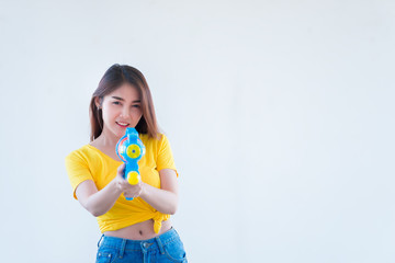 Asian sexy woman with water in hand on white background,Festival songkran day at thailand,The best of festival of thai,Land of  smile