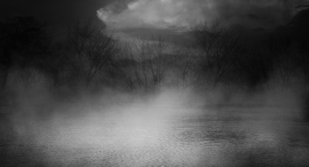 Background scene of empty street. Night view of the river, night sky with clouds, silhouettes of trees, light reflected on water. Smoke fog