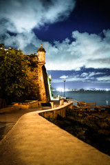 Wall Mural - Beautiful El Morro fortress in Old San Juan Puerto Rico seen at night from along Paseo Del Morro