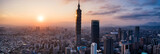 Aerial drone panorama photo - Sunset over the city of Taipei, Taiwan.  Taipei 101 skyscraper featured.  