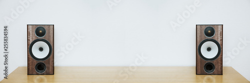 Fotografía two speakers on a wooden table with copyspace, white background