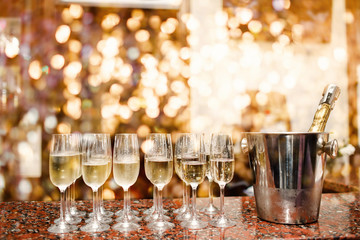 Champagne glasses on golden background. Party and celebration concept.