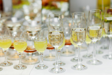 Wall Mural - Champagne glasses. Delicious sweet buffet with cupcakes sparkling wine in party.