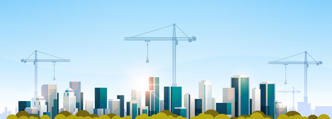 modern city construction site tower cranes building residential buildings cityscape sunset skyline b