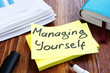 Managing yourself. Office table with papers. Self management concept.