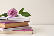 Books With Beautiful Flower On Table