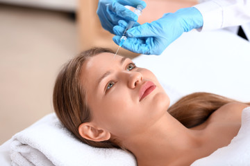 Poster - Young woman receiving injection in beauty salon