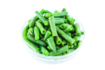 Wall Mural - Green beans on the plate  isolated on white background