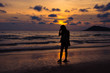 © bellito10 - silhouette girl walking on beach with sunset