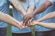 © Prostock-studio - Young happy volunteers outdoor meeting at park