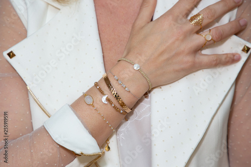 Fotografía Close up Detail of many several bracelet on a Female Hand Model