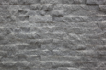 gray brick wall with rough texture