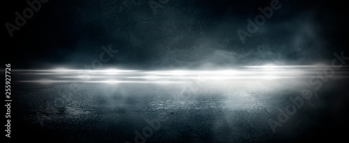 Photographie Wet asphalt, reflection of neon lights, a searchlight, smoke