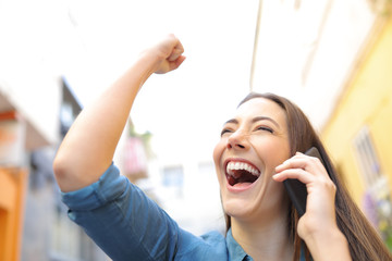 Sticker - Excited woman receiving good news talking on phone