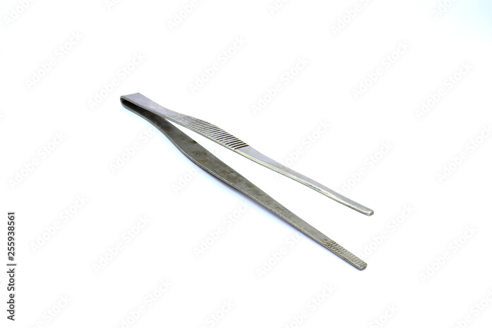 Closeup of dirty medical pincette isolated on white background.