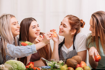 Female cooking classroom. Friendly atmosphere. Healthy eating habit. Dieting together. Food and nutrition tutoring.