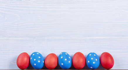 Wall Mural - american easter Easter eggs painted in the style of the American flag.