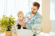 © Iryna - Gentle father with little daughter washing hands in modern bathroom interior. Sanitation, care, nursing hygiene concept.