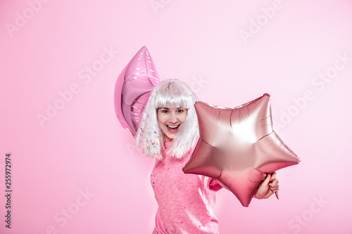 Funny Girl With Silver Hair Gives A Smile And Emotion On Pink