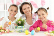 © aletia2011 - Portrait of family painting traditional Easter eggs in different colors at home