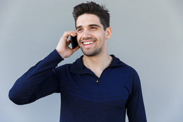 Wall Mural - Cheerful young man talking