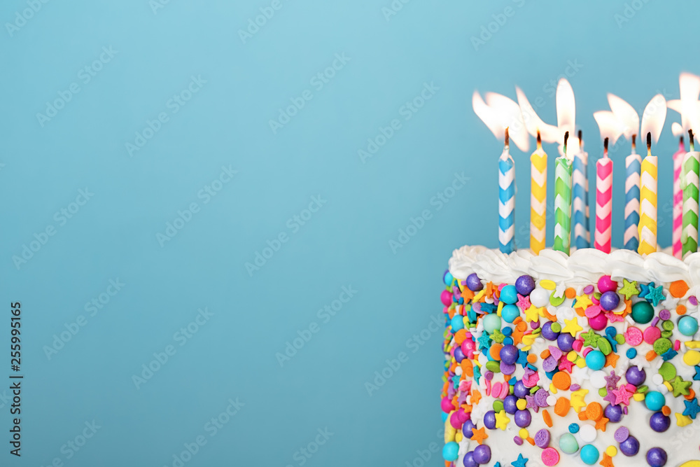 Colorful birthday cake with lots of candles Stock Photo | Adobe Stock