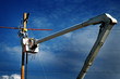 © Lane Erickson - Man Worker Working on Power Lines Crane Bucket High in the Air Dangerous