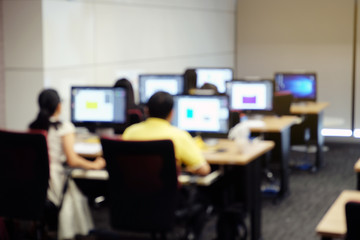 Abstract blur people lecture in computer lab room, education or software training concept