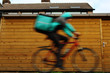 A person on his bike, blurry because of dangerous high speed