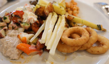 Dish Of The Restaurant Filled With Foods Including Fried Onion R