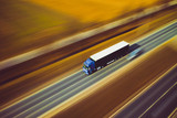 Fototapeta Big Ben - White blue truck speed transport goods highway street motorway