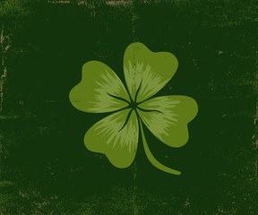 Lucky clover on old dark green paper