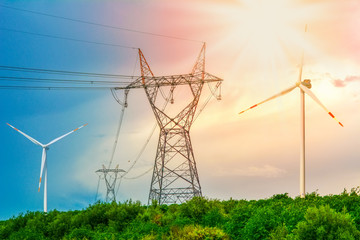 High voltage electricity pylons and transmission power lines on the blue sky background.