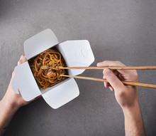 Person Eating Asian Noodles