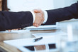 © rogerphoto - Business people shaking hands at meeting or negotiation in the office. Handshake concept. Partners are satisfied because signing contract