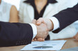 © rogerphoto - Business people shaking hands at meeting or negotiation in the office. Handshake concept. Partners are satisfied because signing contract
