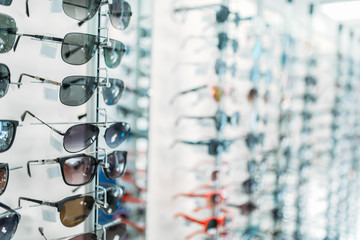 Wall Mural - Eyeglasses and sunglasses showcase in optic shop