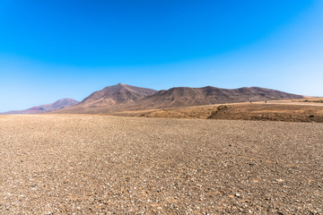 Wall Mural - Panoramic view desert region  Playa Blanca Papagayo - White Beach Papagayo, - at volcanic island Lanzarote, Canary Islands, Spain.  Travel vacation concept.