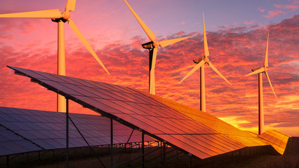 Wall Mural - clean energy concept, photovoltaic panels and wind turbines in the light of the rising sun